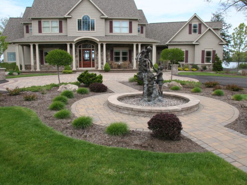 Front yard with landscape design and statue